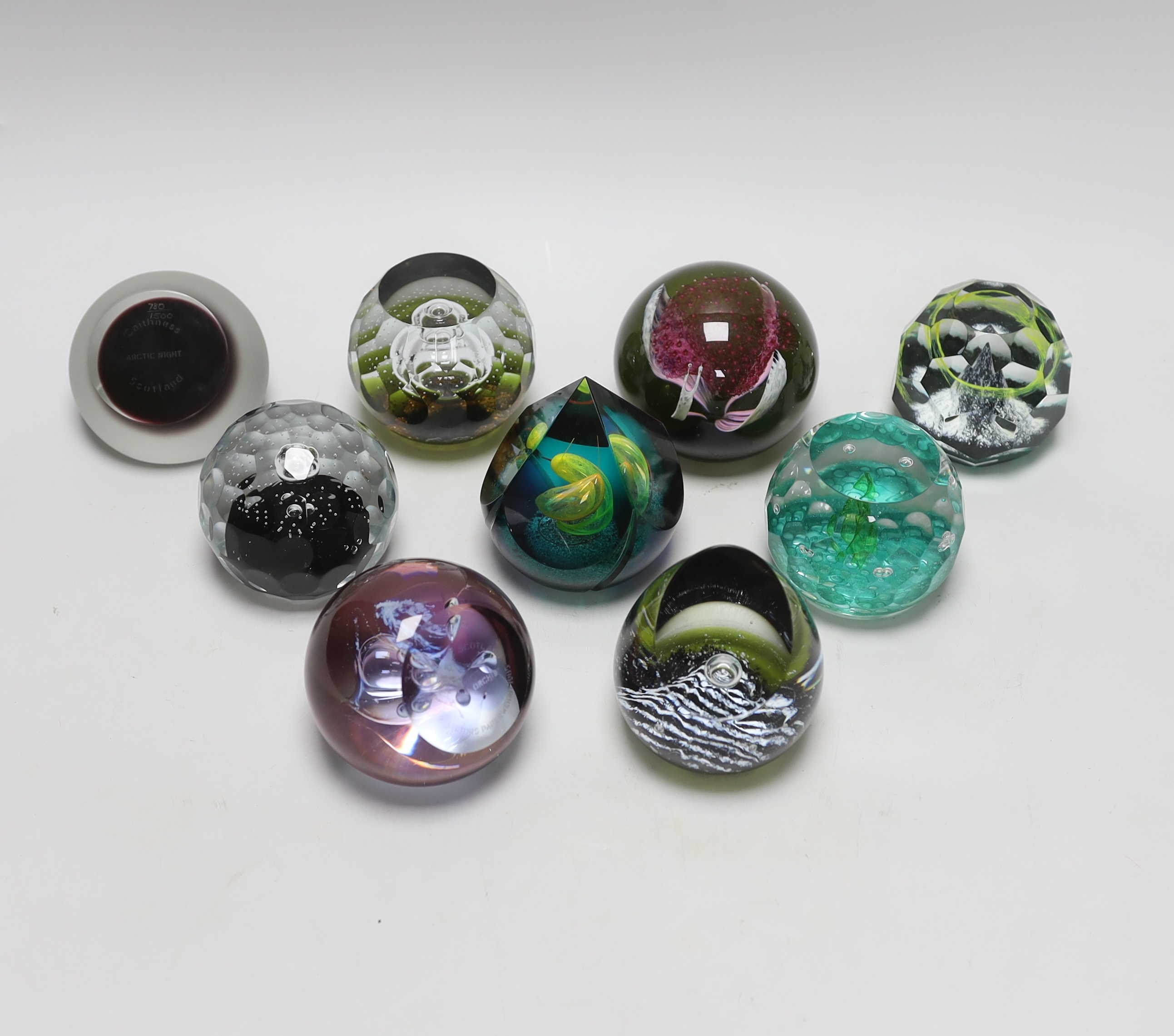Nine Caithness paperweights including Arctic Night, limited edition 780/1500 and Sea nymphs, 114/350, each with boxes, the largest 9cm high